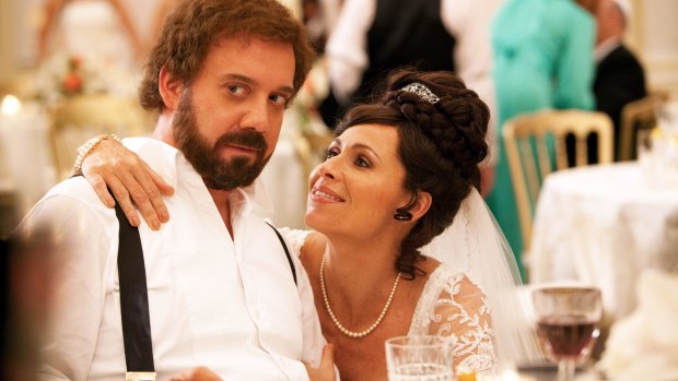 Bridegroom Barney (Paul Giamatti) and his bride (Minnie Driver) at their Ritz Carlton wedding banquet in Barney's Version.