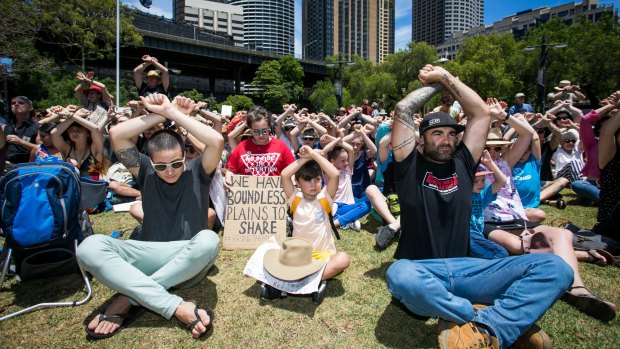 Protesters take part in a protest at First Fleet Park, Circular Quay, on Sunday, to show solidarity with the Manus Island detainees. 