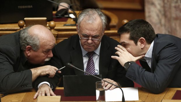 Interior Minister Nikos Voutsis, left, Deputy Prime Minister Giannis Dragasakis, centre,  and Prime Minister Alexis Tsipras, right, are yet to win over eurozone leaders with their policies.
