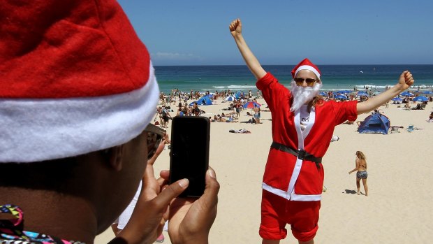Natalie Williams from Britain celebrates Christmas at Bondi Beach.