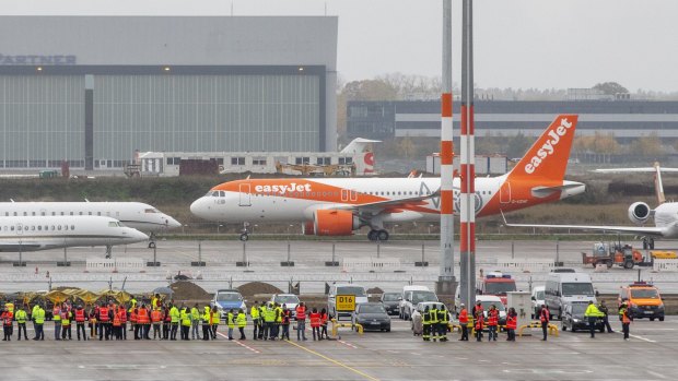 The first flight to arrive at BER airport, operated by Easyjet, after landing on Saturday.