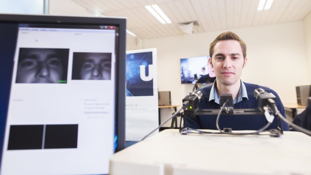 Dr Armin Haller, manager of the W3C Australian office which will be involved in the development of the world wide web, looks into eye-tracking cameras at the ANU.