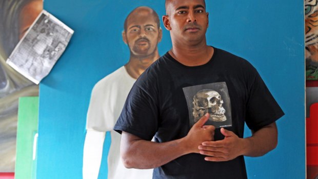  Myuran Sukumaran, in front of a self-portrait, has improved rapidly.  "Every visit ... I find he's made more remarkable progress,'' Ben Quilty says. 