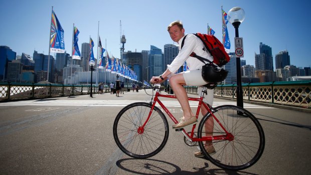 Micheal Stoddart on his bike on Sydney's Pyrmont Bridge. 