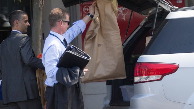 Police gather evidence at the scene where Joseph Acquaro's body was found on Tuesday morning.