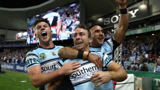 Party time: Chad Townsend, James Maloney and Valentine Holmes celebrate. 