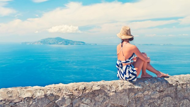 We all think about travelling when we're broken-hearted. But is this actually a good idea after a break-up? Picture, Monte Solaro on Capri Island, Italy.