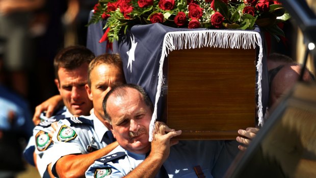 Police officers carry the coffin at the funeral of Detective Inspector Bryson Anderson at St Patrick's Church in Paramatta,in December 2012.