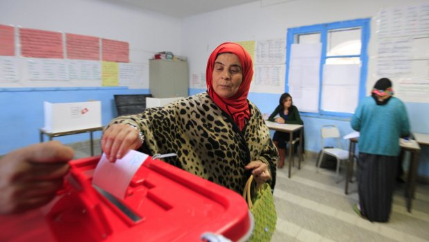 A Tunisian woman casts her ballot in the capital Tunis on Sunday.