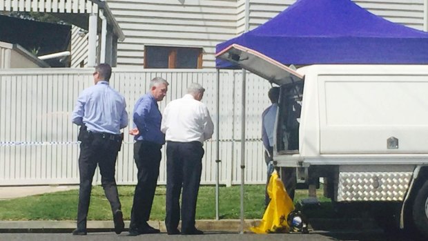 Police at the Kedron home where Sidney PLayford was found dead.