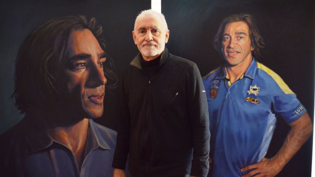 Canberra artist Peter Engel with his two portraits of Johnathan Thurston.