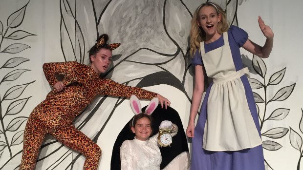 Nicole Carr as the Cheshire Cat, left, Jade Breen as the White Rabbit, Sarah O'Neill as Alice in Ickle Pickle's Alice in Wonderland.