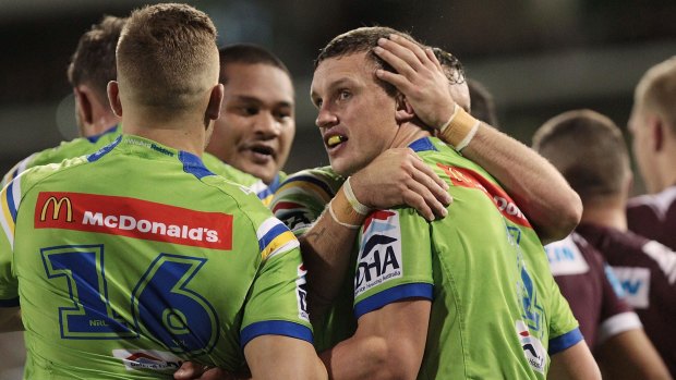 Jack Wighton is congratulated by Raiders teammates on Friday night.