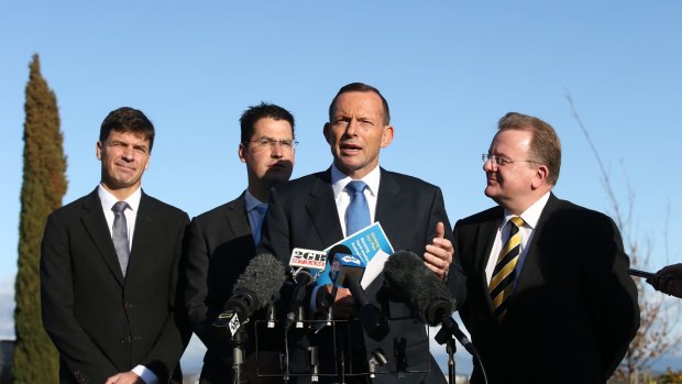 Prime Minister Tony Abbott during a press conference with Angus Taylor, Senator Zed Seselja and Bruce Bilson after he visited a small business breakfast at Pialligo Estate Farmhouse Restaurant in Canberra on Monday.