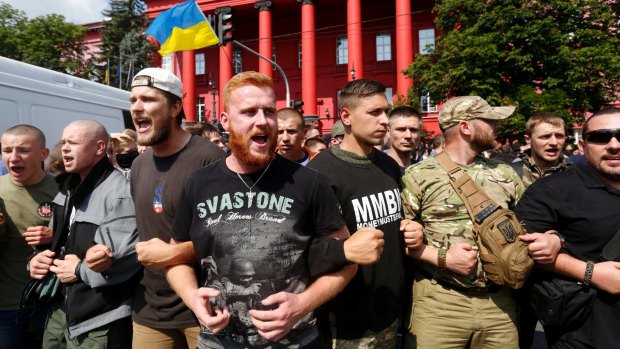 Ukrainian ultra nationalist activists shout slogans as they protest against the annual Gay Pride parade.