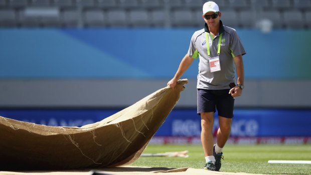 Australian selector Mark Waugh inspects the pitch at Eden Park on Friday.