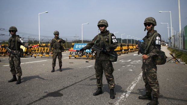 South Korean soldiers stand guard at the Grand Unification Bridge, which leads to the truce village Panmunjom.