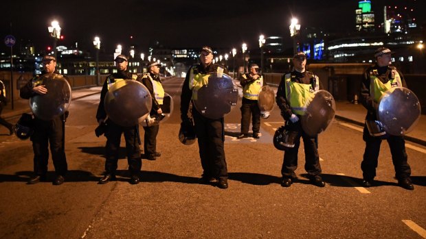 Police at the scene at Southwark Bridge in London.