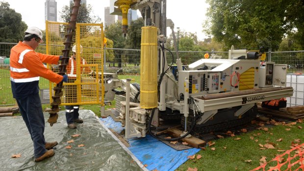 Workers conduct test drilling for the Melbourne Metro rail project in gardens off St Kilda Road  in April 2015.