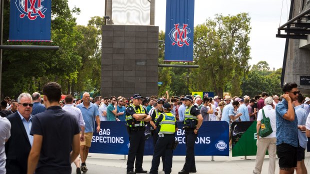 Police outside the MCG as crowds pour into the ground.