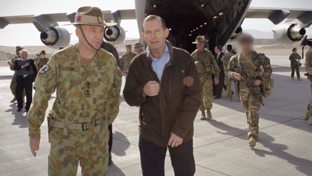 Then Prime Minister Tony Abbott in Tarin Kowt, Oruzgan Province, Afghanistan where, in October 2013, he attended a Recognition Ceremony to honour the 40 Australian lives lost during the 12-year conflict.  