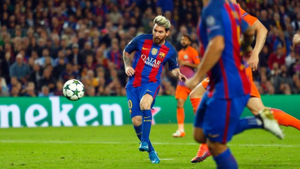Messi scores his side's third goal.