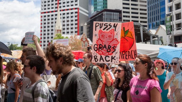 Hundreds braved a hot Brisbane morning to protest against the inauguration of Donald Trump.