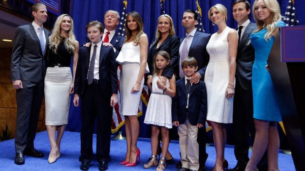 Donald Trump, fourth left, poses with his family in June after his announcement that he will run for president of the United States. From lef are: son Eric Trump, with his wife Lara Yunaska; Donald Trump's son Barron Trump, wife Melania Trump; Vanessa Haydon and her husband Donald Trump Jr; daughter Ivanka Trump with her husband Jared Kushner; daughter Tiffany Trump. In the front row are Kai Trump and Donald Trump III, children of Donald Trump Jr.