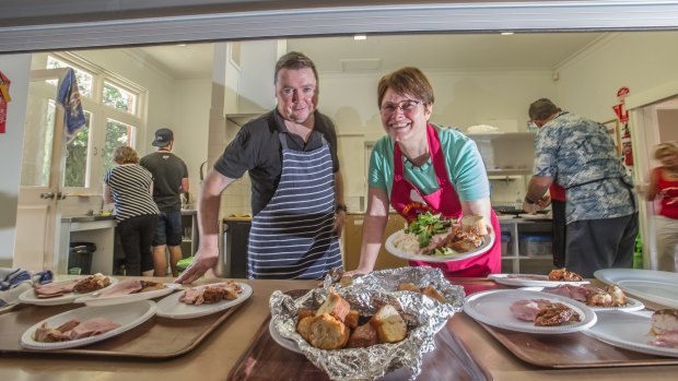 Bruce Millar and Annette Pilloni help to dish up two course Christmas lunch for 250. 