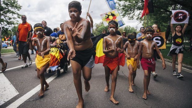 Indigenous Australians lead a march to the Aboriginal Tent Embassy in Canberra.