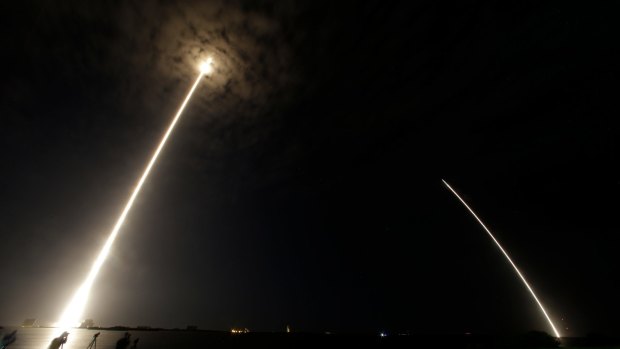 In this time lapse image, you can see the Falcon 9 SpaceX rocket lift off (left) and the booster returning on the right.