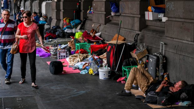 A large homeless camp outside Flinders Street Station.