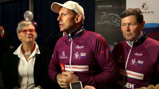 Tony Abbott and Kevin Andrews are joined by Carers Australia chief  executive Ara Cresswell after a charity bike ride in August 2014.