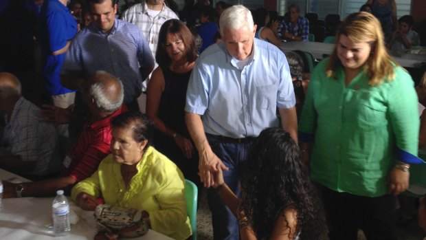 Vice-President Mike Pence greets community members at a meal following church services in San Juan, Puerto Rico.