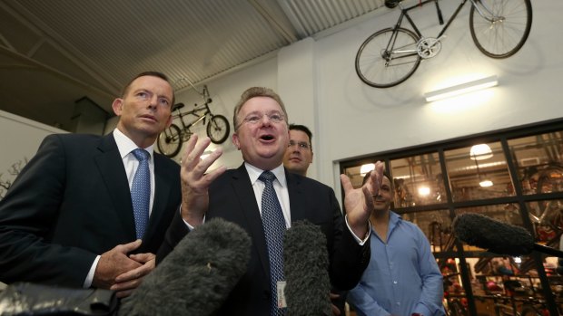 Bruce Billson with then prime minister Tony Abbott during a visit to Celestino Cafe in Fyshwick, Canberra, in May.