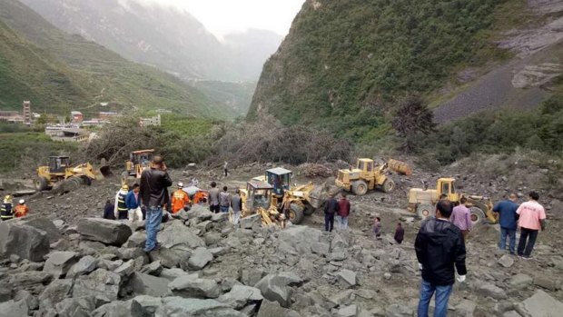 The landslide on Saturday morning smashed some 40 homes, where more than 100 people are feared to be buried.