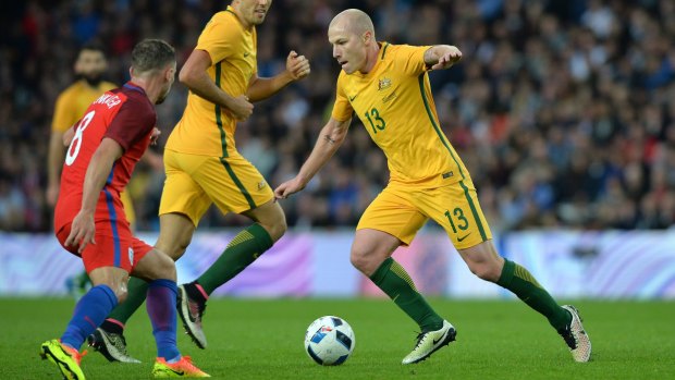 Look at Mooy: Socceroos midfielder Aaron Mooy takes on England's Danny Drinkwater at the Stadium of Light.