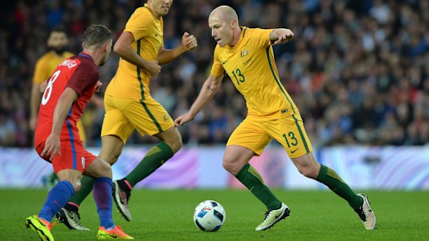 Look at Mooy: Socceroos midfielder Aaron Mooy takes on England's Danny Drinkwater at the Stadium of Light.