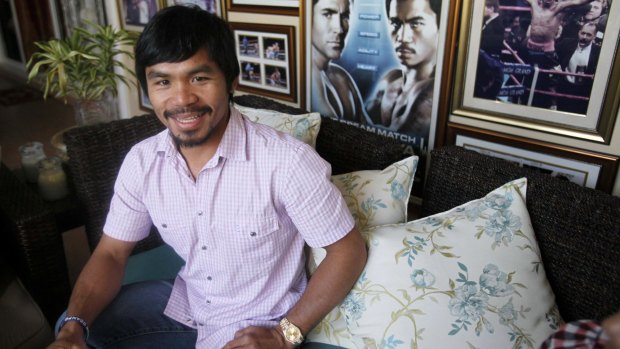 Filipino boxer Manny Pacquiao smiles during a news conference at his mansion in General Santos city in southern Philippines in 2010. Pacquiao has been an inspiration for millions of Filipinos not just as a boxer, but as a philanthropist. 
