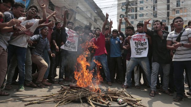 Bangladeshi students protest seeking the arrest of three motorcycle-riding assailants who hacked student activist Nazimuddin Samad to death earlier this month.