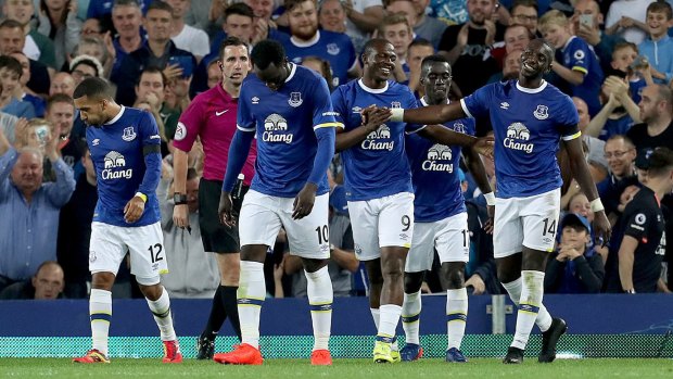 Everton's Arouna Kone, third right, celebrates scoring his side's third goal.