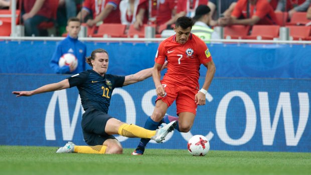 Australia's Jackson Irvine tackles Chile's Alexis Sanchez in the Confederations Cup in June.