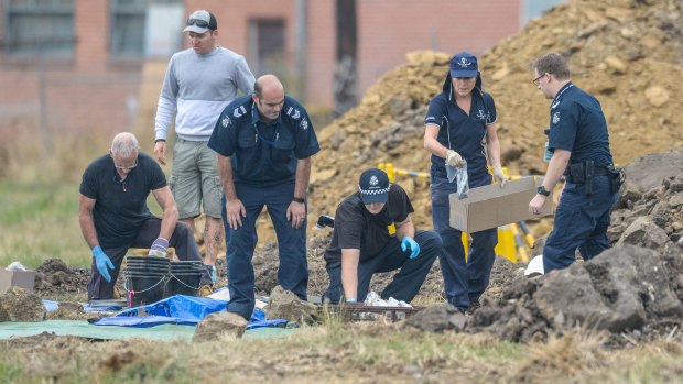 Police sort evidence found in the excavations in Thomastown.