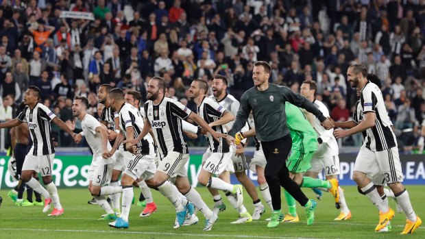 Juventus' players celebrate their victory.