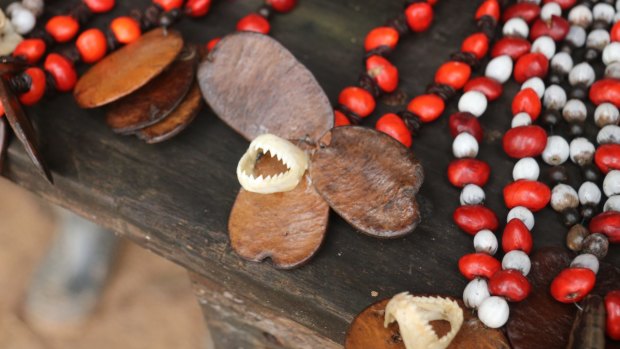 The only sign of piranhas - teeth on a necklace at a market stall.