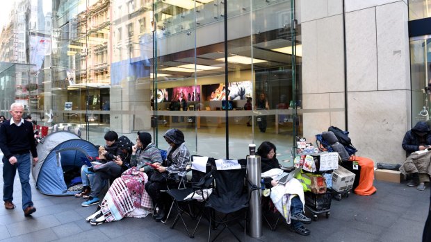 Tent city: iPhone fans (and those working as place holders) outside Apple's Sydney store in George St on Friday morning.