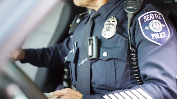 This image of a US police officer shows the body camera worn as part of the uniform.