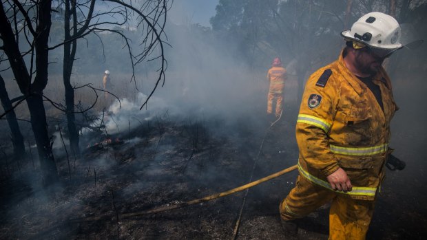 RFS crews battle a grass fire in Claremont Meadows on Tuesday as January came to a scorching end.