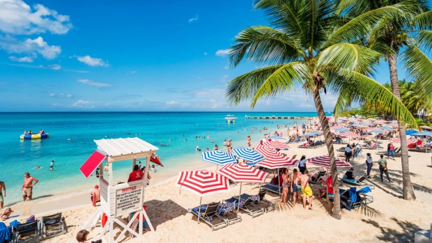 Tourists at a beach in Montego Bay, Jamaica.