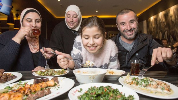 Hanadyi, Rouba, Dana and Ahmad dig into a Lebanese feast at Al Aseel Restaurant to break the fast during Ramadan.